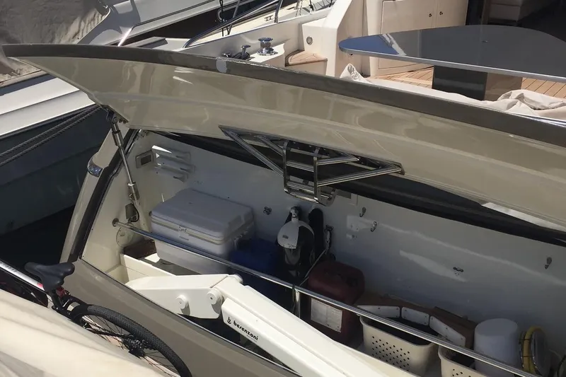  Yacht Photos Pics Storage compartment of a 2008 Uniesse 68 yacht, featuring various equipment and supplies.