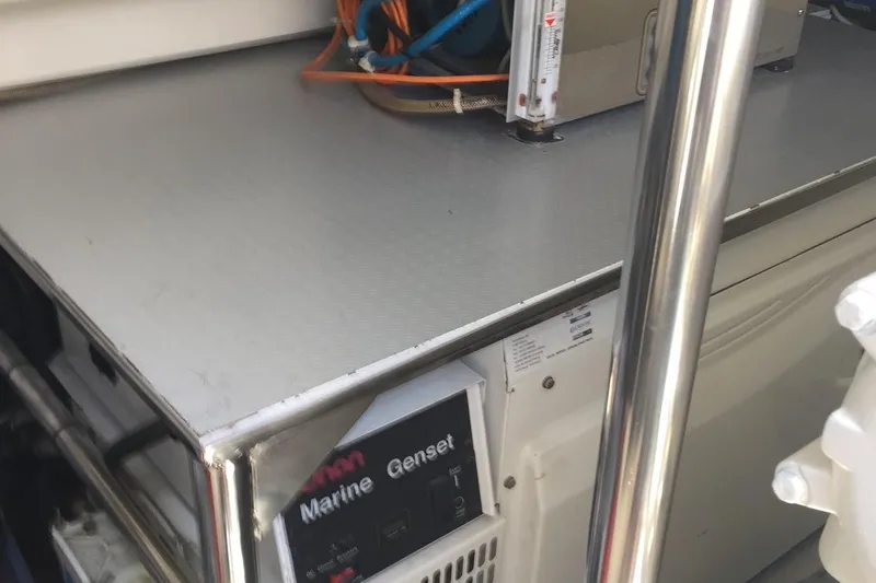  Yacht Photos Pics Engine room of 2008 Uniesse 68 yacht with marine generator and equipment.