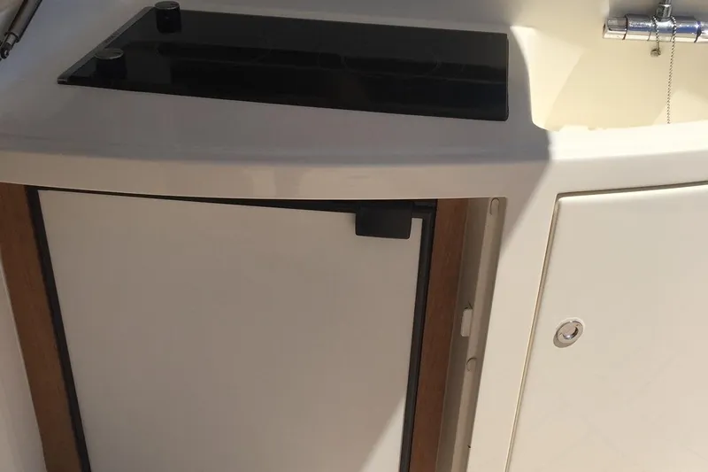  Yacht Photos Pics 2008 Uniesse 68 yacht kitchenette with sink and storage.