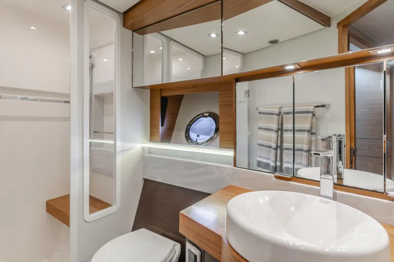 Chapter Three Yacht Photos Pics Luxurious bathroom in 2018 Tiara F44 yacht with modern fixtures and elegant design.