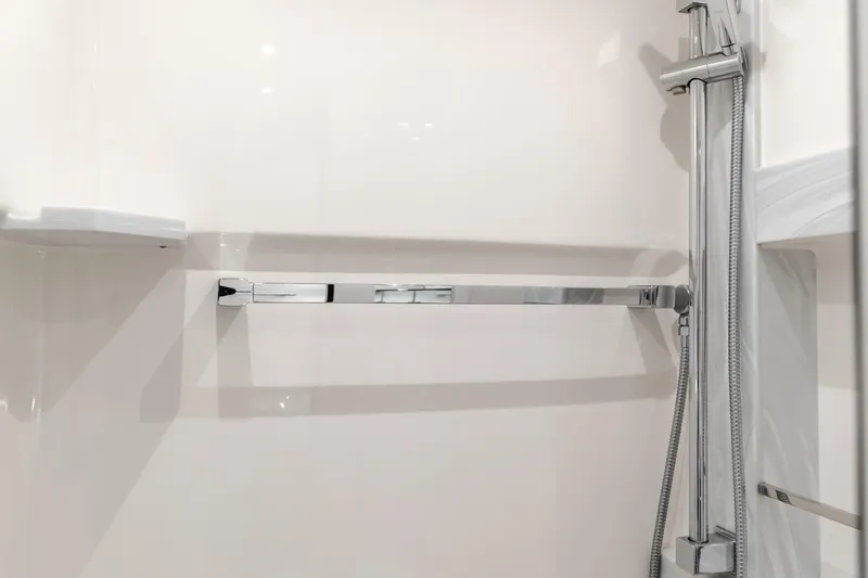 Chapter Three Yacht Photos Pics Modern shower area in 2018 Tiara F44 yacht with chrome fixtures.