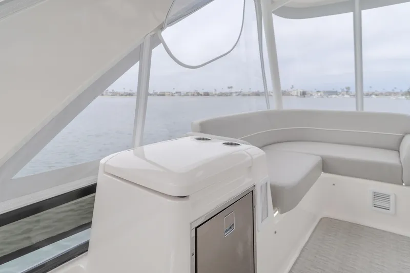 Chapter Three Yacht Photos Pics Interior of 2018 Tiara F44 yacht with sleek seating and ocean view.