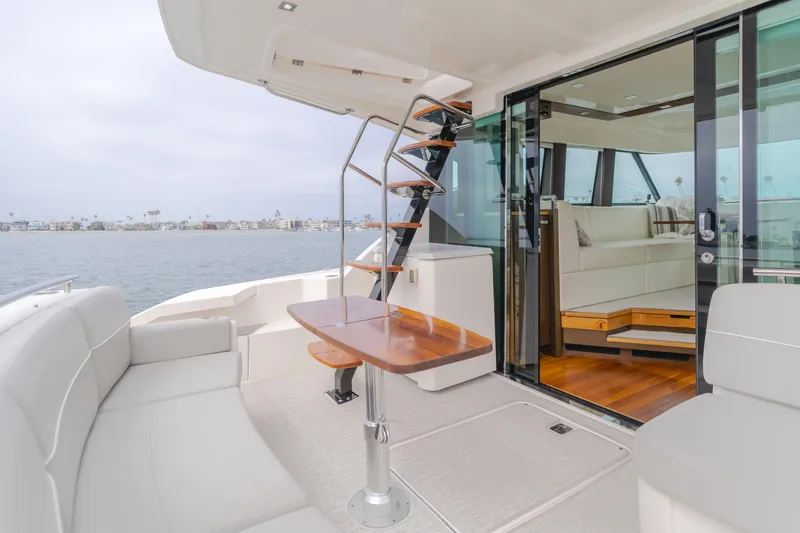 Chapter Three Yacht Photos Pics Luxurious 2018 Tiara F44 yacht interior with elegant seating and ocean view.