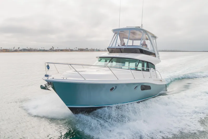 Chapter Three Yacht Photos Pics 2018 Tiara F44 yacht cruising on open water, showcasing sleek design and performance.