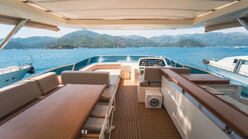  Yacht Photos Pics Luxurious 2013 Azimut 84 yacht deck with scenic ocean and mountain views.