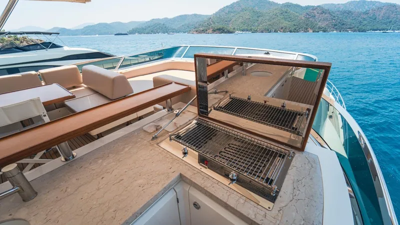  Yacht Photos Pics Luxurious 2013 Azimut 84 yacht deck with grill, seating, and scenic ocean view.