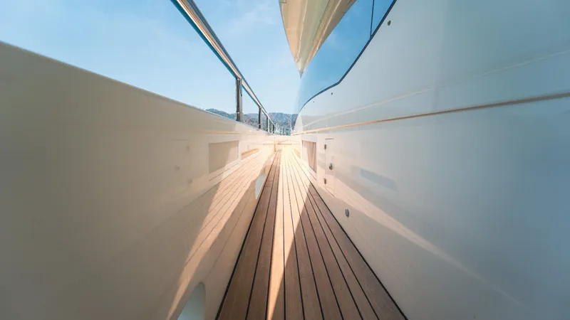  Yacht Photos Pics Side deck view of 2013 Azimut 84 yacht, showcasing sleek design and wooden flooring.