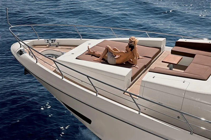  Yacht Photos Pics Couple relaxing on 2013 Azimut 84 yacht deck, enjoying sunny ocean view.