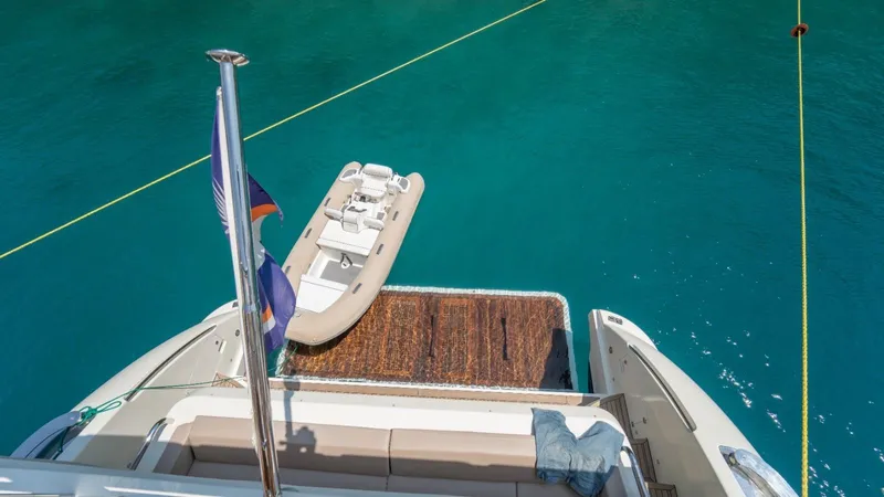  Yacht Photos Pics Azimut 84 yacht with tender boat on turquoise water, 2013 model.
