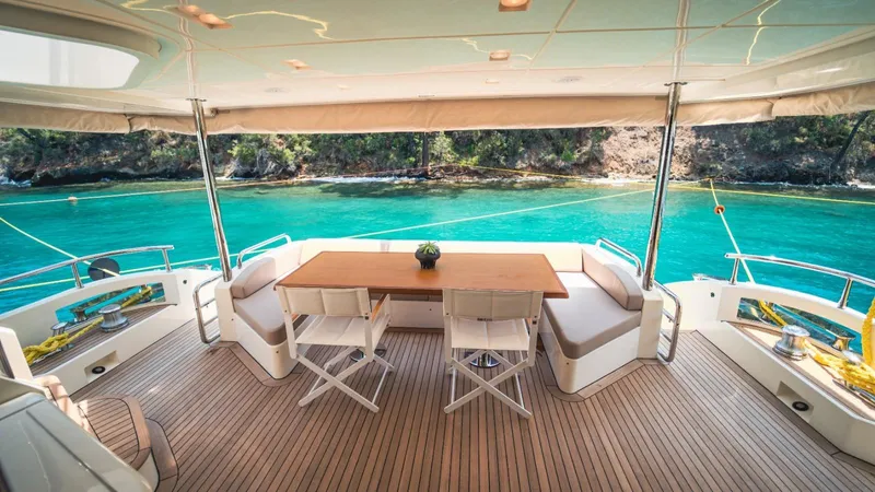  Yacht Photos Pics Luxurious 2013 Azimut 84 yacht deck with seating, overlooking turquoise waters and scenic coastline.