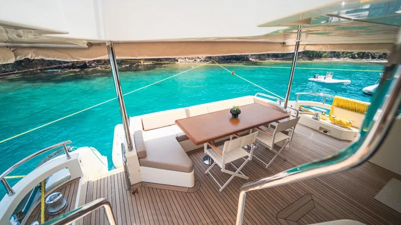  Yacht Photos Pics Luxurious 2013 Azimut 84 yacht deck with dining area overlooking turquoise waters.