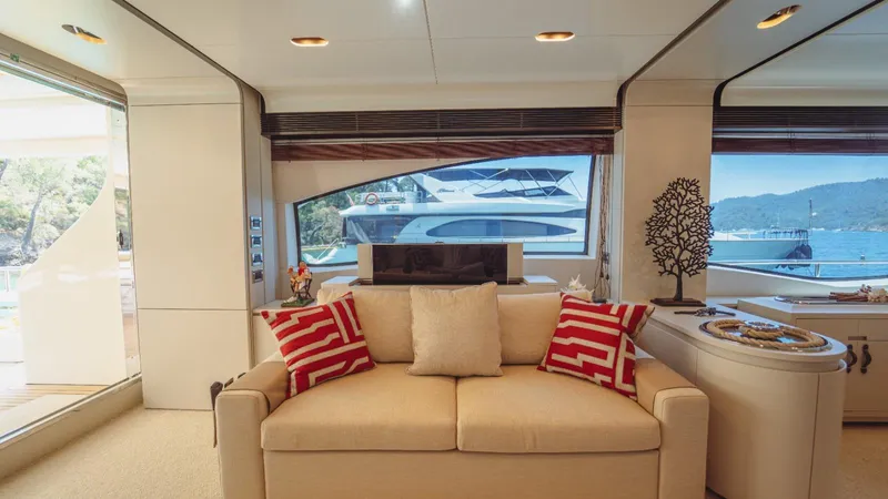  Yacht Photos Pics Luxurious interior of 2013 Azimut 84 yacht with elegant sofa and scenic window view.