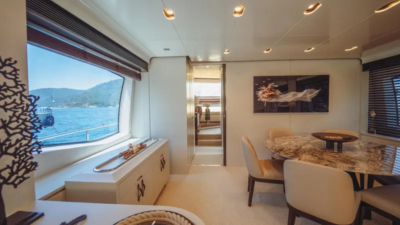  Yacht Photos Pics Luxurious interior of 2013 Azimut 84 yacht with elegant dining area and scenic ocean view.