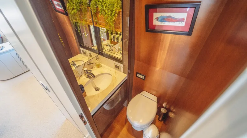  Yacht Photos Pics Luxurious bathroom on 2013 Azimut 84 yacht with elegant wood paneling and modern fixtures.