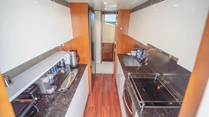  Yacht Photos Pics Modern kitchen interior on 2013 Azimut 84 yacht with sleek countertops and appliances.