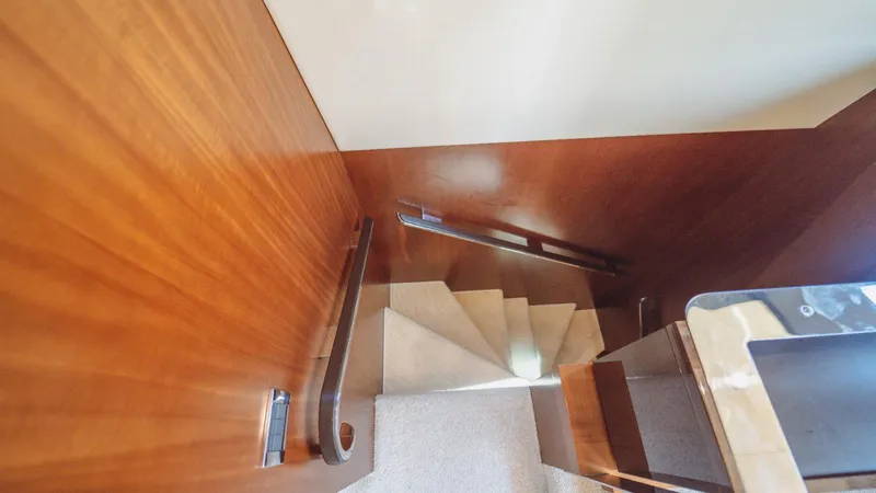  Yacht Photos Pics Staircase with wooden paneling inside a 2013 Azimut 84 yacht.