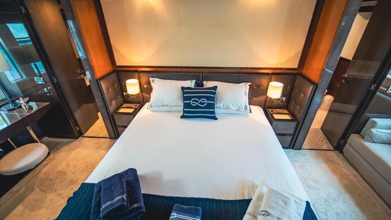  Yacht Photos Pics Luxurious bedroom interior of 2013 Azimut 84 yacht with elegant bedding and ambient lighting.