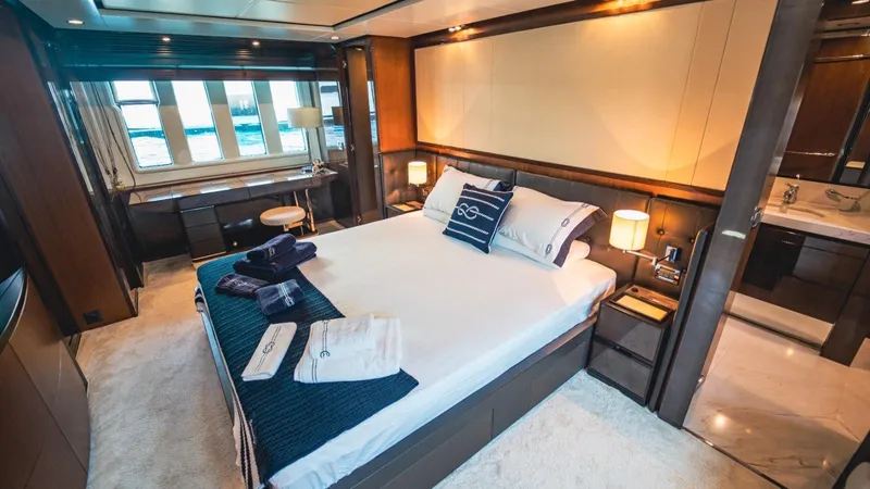  Yacht Photos Pics Luxurious bedroom interior on a 2013 Azimut 84 yacht, featuring elegant furnishings and ocean views.