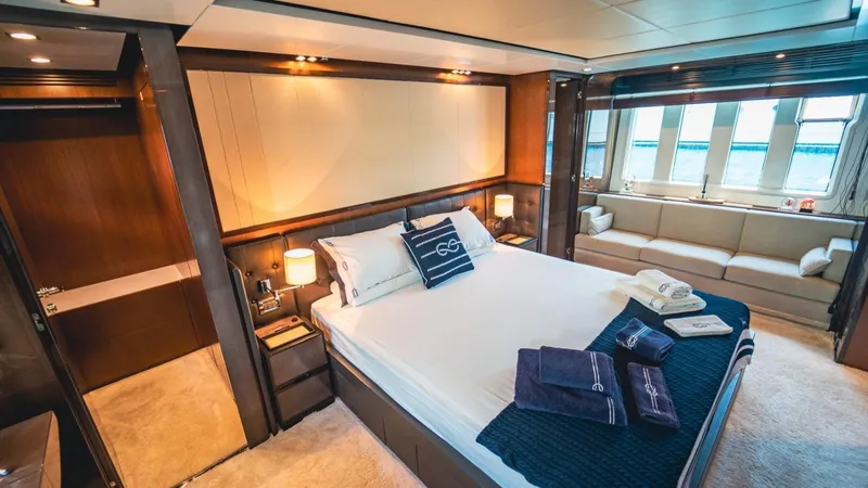  Yacht Photos Pics Luxurious bedroom interior of 2013 Azimut 84 yacht with elegant furnishings and large windows.