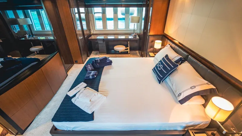  Yacht Photos Pics Luxurious bedroom interior on 2013 Azimut 84 yacht, featuring elegant bedding and modern decor.
