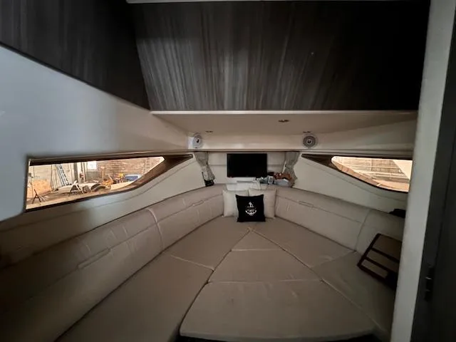 Sortuda Yacht Photos Pics Interior cabin of a 2020 Sea Ray Sundancer 320 yacht with beige seating.