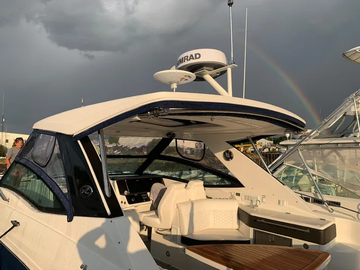 Sortuda Yacht Photos Pics 2020 Sea Ray Sundancer 320 yacht with a rainbow in the background.