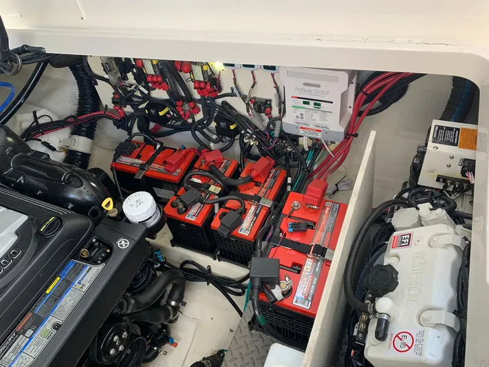 Sortuda Yacht Photos Pics Engine compartment of a 2020 Sea Ray Sundancer 320 with batteries and wiring.