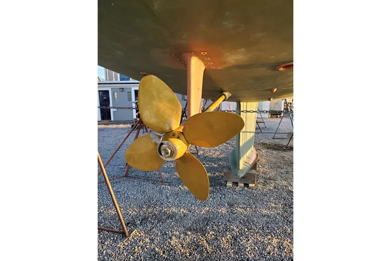 Centurion Yacht Photos Pics Propeller of 2023 Bluewater 56 yacht on gravel surface.