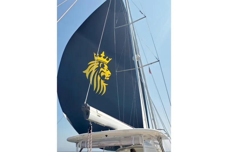 Centurion Yacht Photos Pics 2023 Bluewater 56 sailboat with a lion emblem on the sail.
