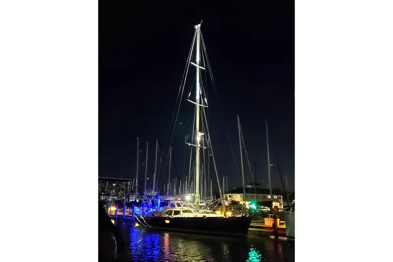 Centurion Yacht Photos Pics Sailboat Bluewater 56, 2023 model, illuminated at night in a marina setting.