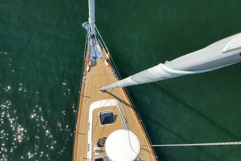 Centurion Yacht Photos Pics Aerial view of 2023 Bluewater 56 sailboat deck on calm green water.