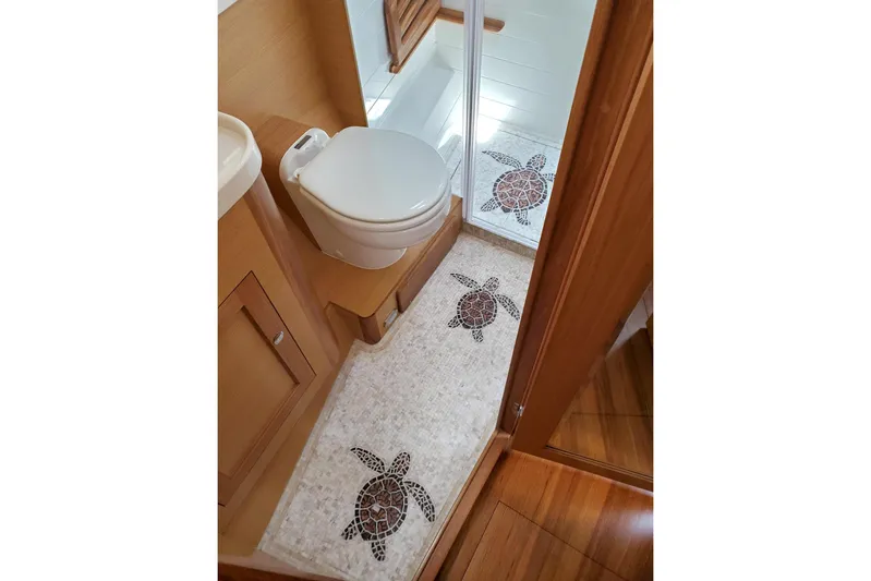 Centurion Yacht Photos Pics Bathroom interior of 2023 Bluewater 56 yacht with turtle-themed decor.