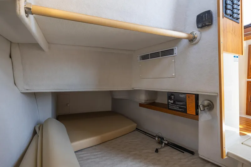  Yacht Photos Pics 2023 Ranger Tugs R-31 S interior cabin with storage and seating area.