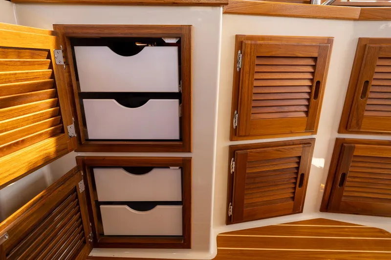 Yacht Photos Pics 2023 Ranger Tugs R-31 S interior with wooden cabinets and drawers.
