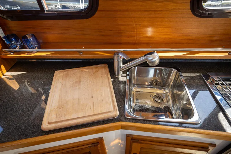  Yacht Photos Pics 2023 Ranger Tugs R-31 S kitchen with sink and cutting board.
