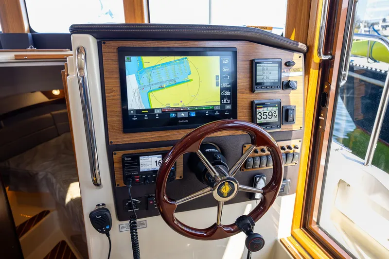  Yacht Photos Pics 2023 Ranger Tugs R-31 S helm with navigation display and controls.
