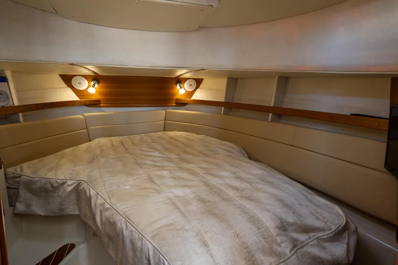  Yacht Photos Pics 2023 Ranger Tugs R-31 S interior cabin with cozy bed and ambient lighting.