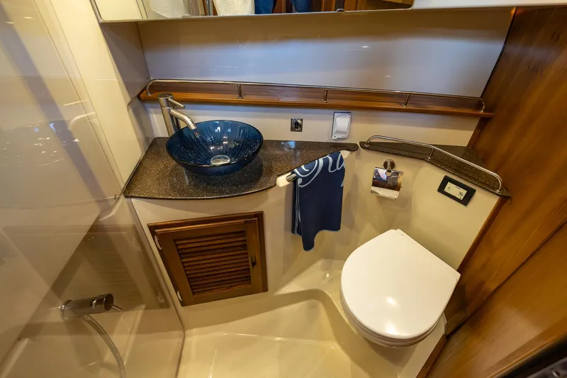  Yacht Photos Pics 2023 Ranger Tugs R-31 S bathroom with modern sink and toilet.