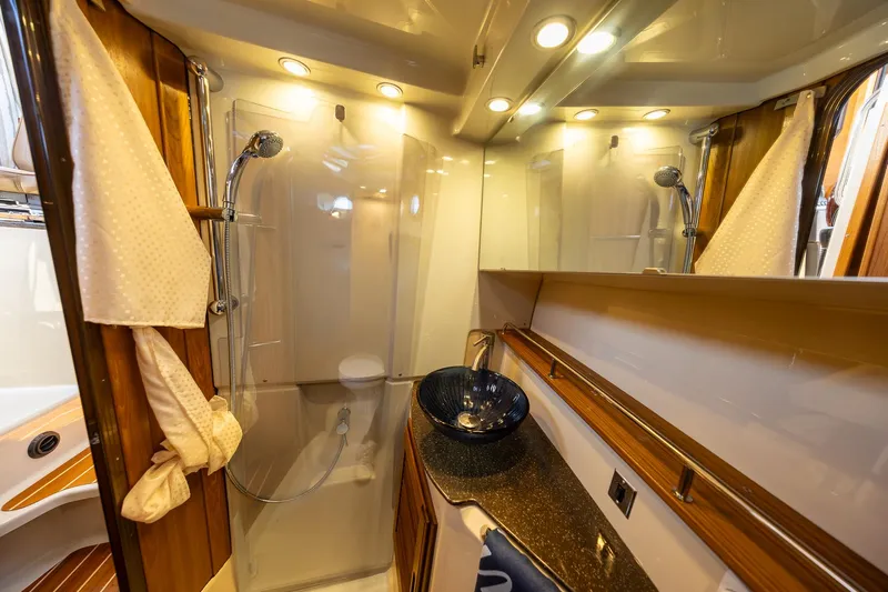 Yacht Photos Pics Luxurious bathroom in 2023 Ranger Tugs R-31 S boat with modern fixtures.