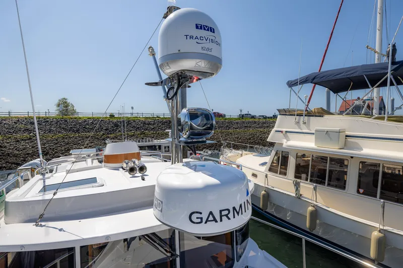  Yacht Photos Pics 2023 Ranger Tugs R-31 S boat with Garmin and TracVision equipment docked in marina.