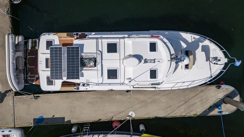  Yacht Photos Pics 2023 Ranger Tugs R-31 S boat docked, aerial view, featuring solar panels.
