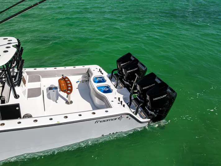  Yacht Photos Pics 2024 Freeman 42 LR boat with dual Mercury engines on turquoise water.