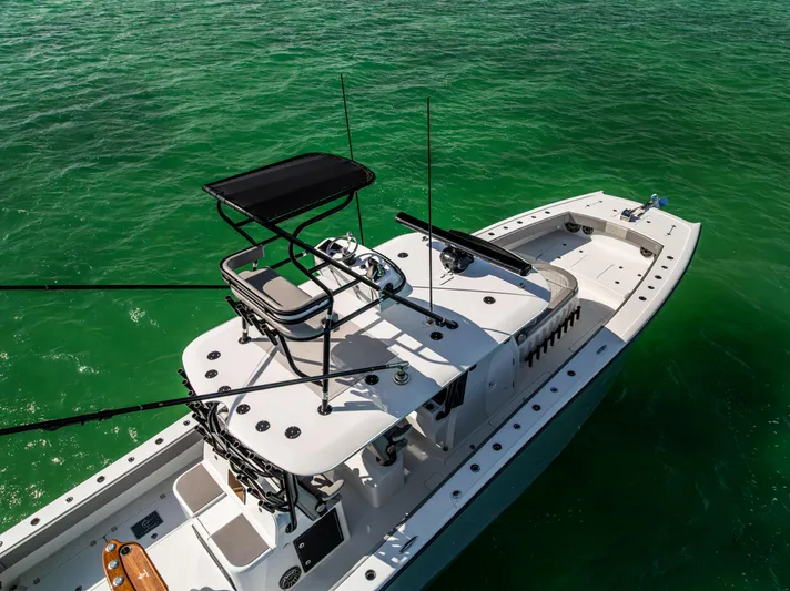  Yacht Photos Pics 2024 Freeman 42 LR boat on vibrant green water, aerial view.