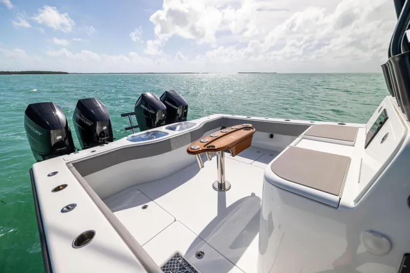  Yacht Photos Pics 2024 Freeman 42 LR boat deck with four engines, set against a serene ocean backdrop.