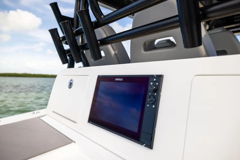  Yacht Photos Pics 2024 Freeman 42 LR boat dashboard with navigation display, sleek design, and rod holders.