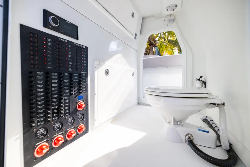  Yacht Photos Pics 2024 Freeman 42 LR interior with control panel and marine toilet.