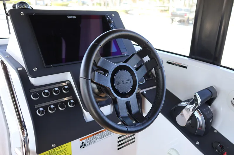  Yacht Photos Pics 2024 XO Boats EXPLR 10 S Plus helm with steering wheel and control panel.