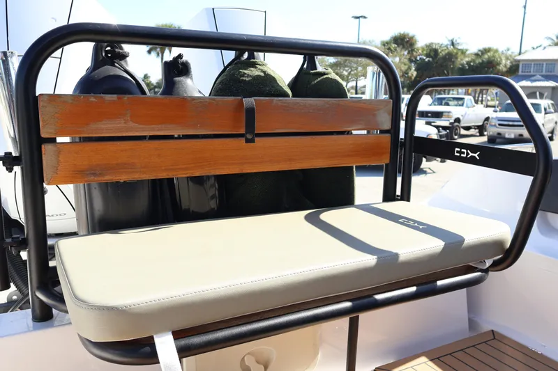  Yacht Photos Pics 2024 XO Boats EXPLR 10 S Plus bench seat with wooden backrest and cushioned seating.