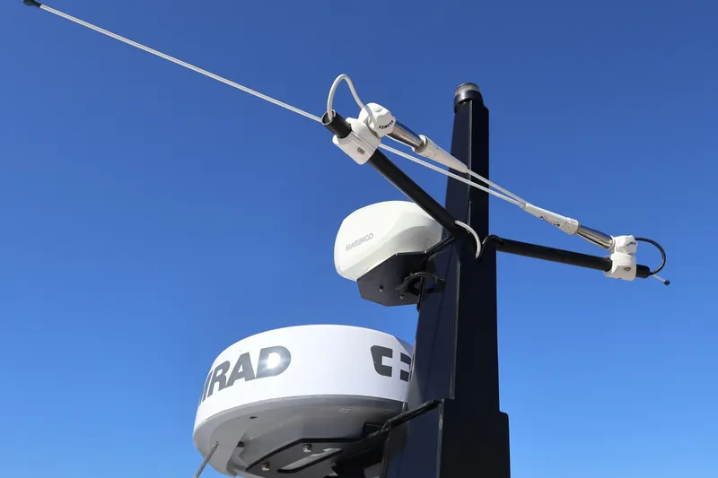  Yacht Photos Pics Radar and antenna equipment on 2024 XO Boats EXPLR 10 S Plus against clear blue sky.