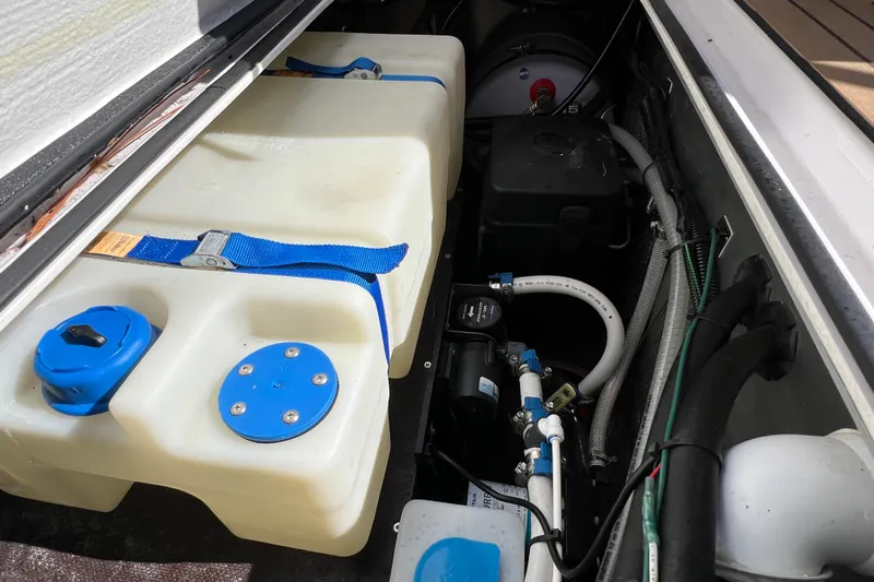  Yacht Photos Pics 2024 XO Boats EXPLR 10 S Plus engine compartment with water tank and plumbing.